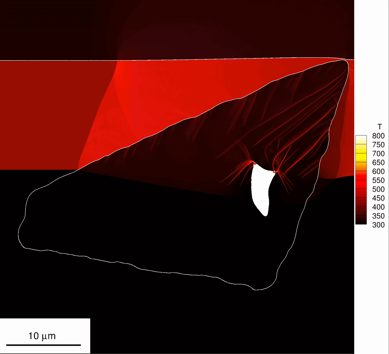 Simulation snapshot showing pore collapse and damage signatures during shock loading of an HMX crystal-binder microstructure.